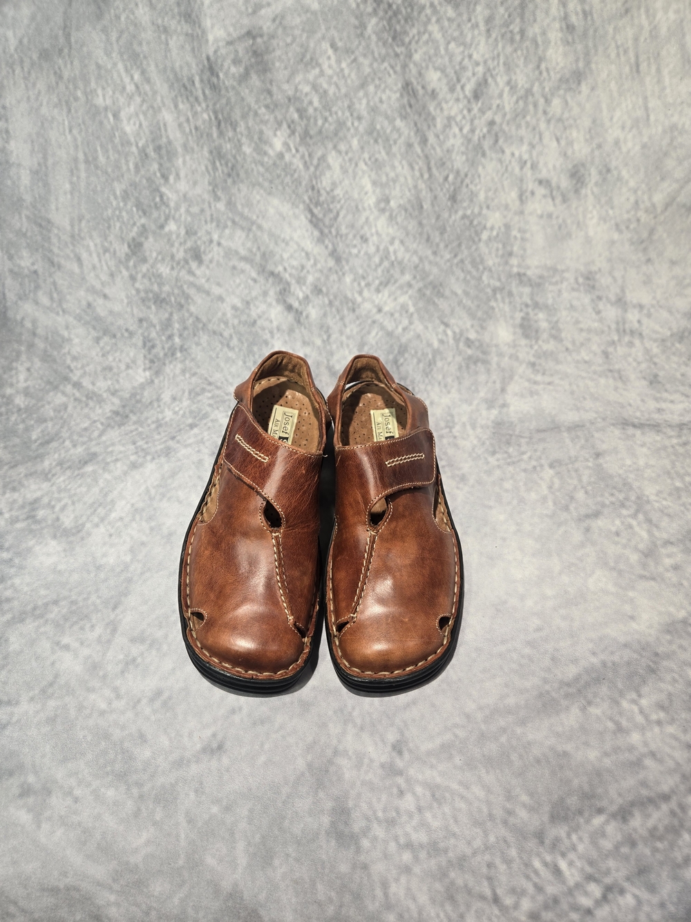 Josef Seibel brown leather closed-toe sandals.